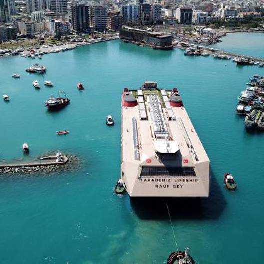 A ship is folating at the sea.