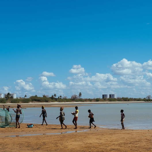 Fishermen are in the sea.